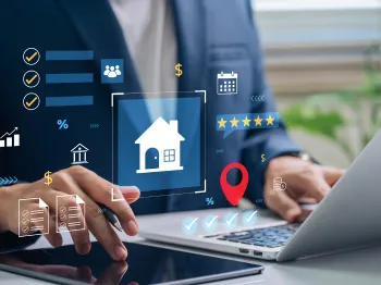 Business professional reviewing property and local business evaluation data on a laptop